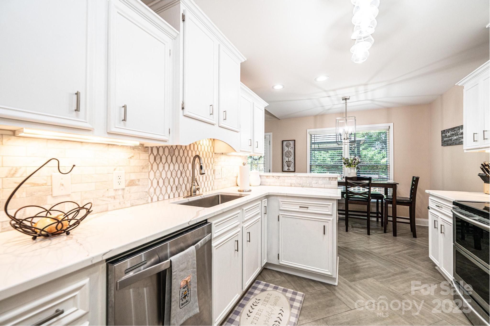 1784 New Star Drive Newton, NC 28658 - Photo 8 of 27 a kitchen with a sink stove and cabinets