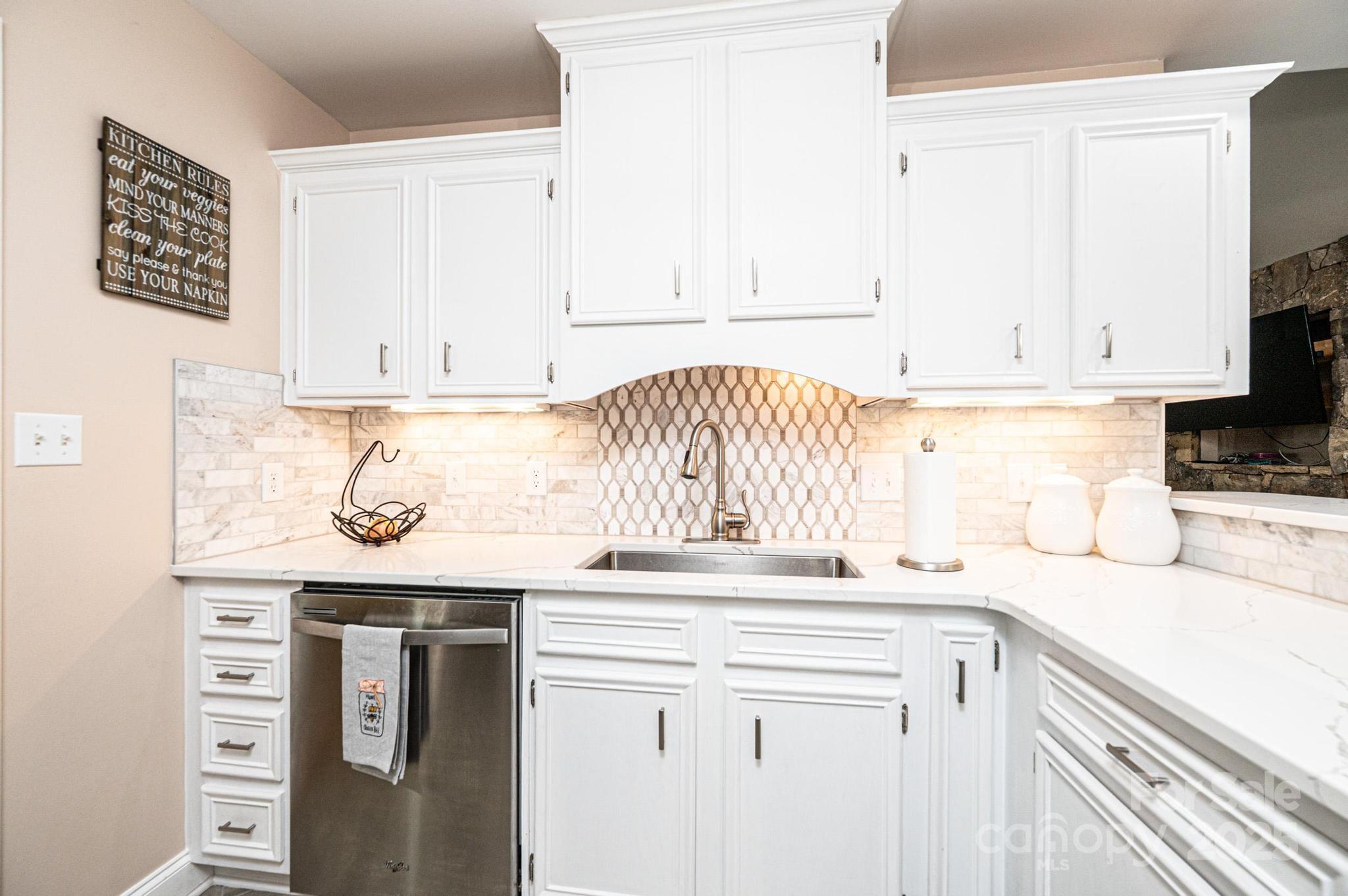 1784 New Star Drive Newton, NC 28658 - Photo 9 of 27 a kitchen with granite countertop white cabinets and sink