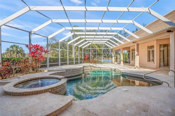 a view of a house with backyard sitting area and porch