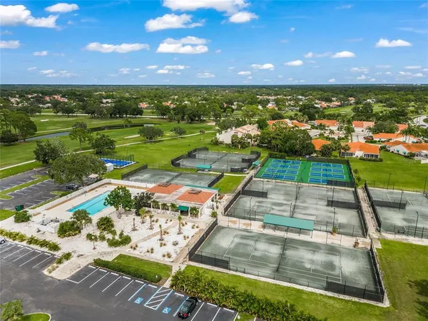 a view of a lake with houses in the background