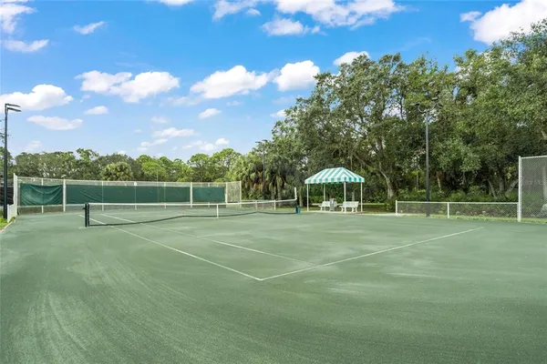 front view of a house with a tree in front of it