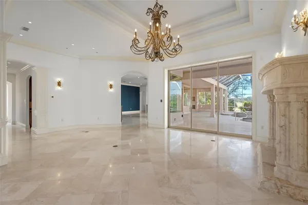 a view of an empty room with a fireplace