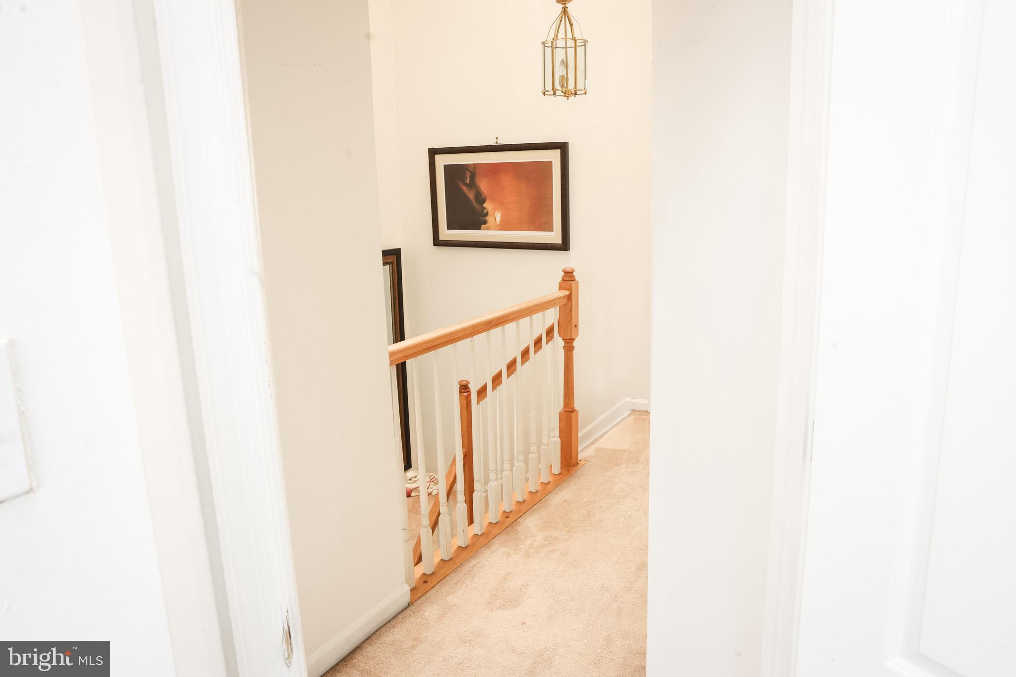 4234 Huntshire Road Randallstown, MD 21133 - Photo 21 of 43 a view of a hallway with stairs