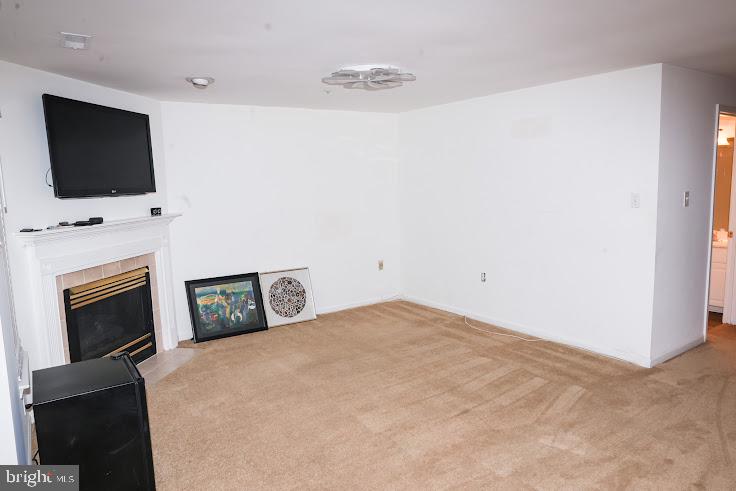 4234 Huntshire Road Randallstown, MD 21133 - Photo 33 of 43 a bedroom with a bed and a flat screen tv