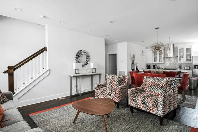 a living room with furniture and a painting