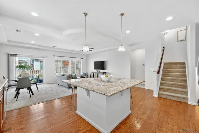 a living room with furniture kitchen view and a view