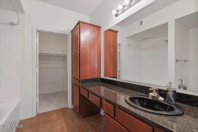 an empty room with a empty space and chandelier fan