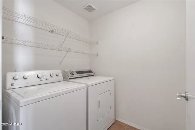 a view of a patio with a table and chairs