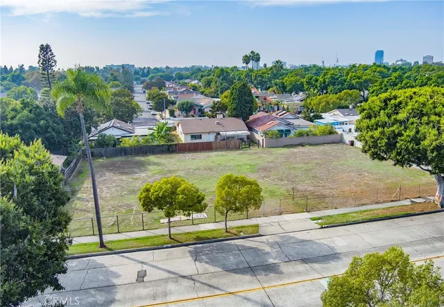an aerial view of a house with a yard basket ball court and outdoor seating