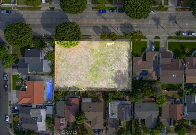 an aerial view of residential houses and outdoor space