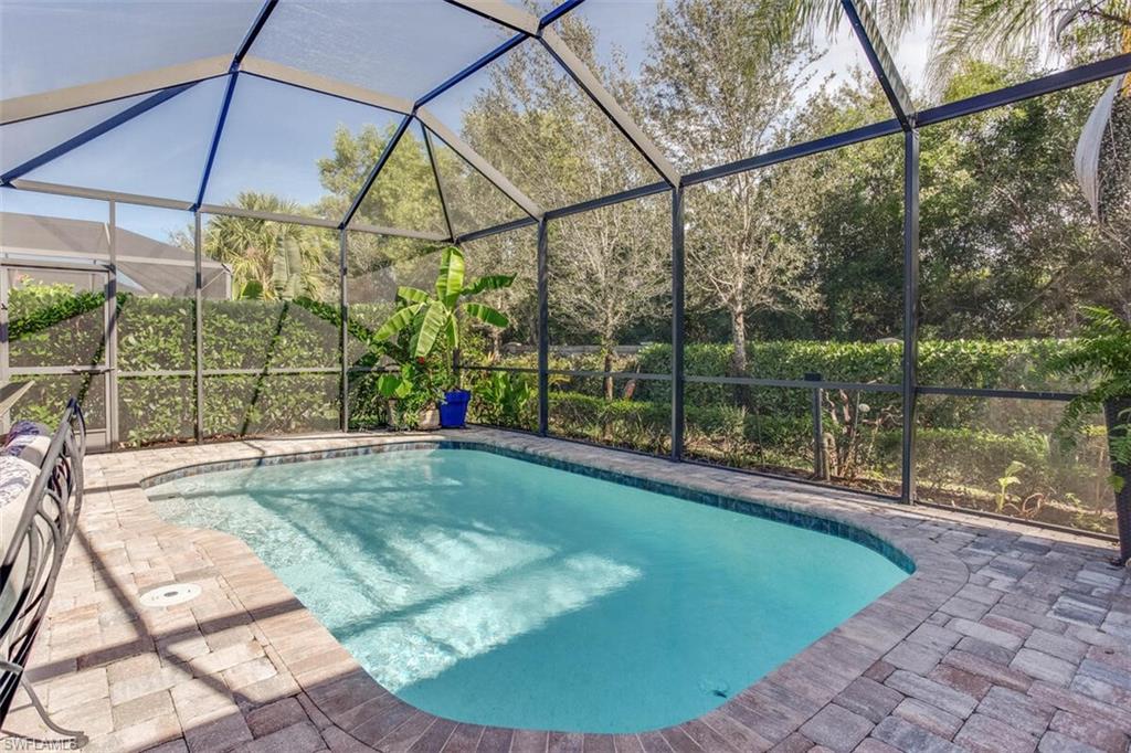 7682 Jacaranda Lane Naples, FL 34114 - Photo 33 of 44 a view of a house with swimming pool