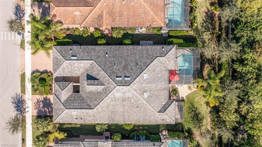 7682 Jacaranda Lane Naples, FL 34114 - Photo 34 of 44 an aerial view of a house with a yard and potted plants