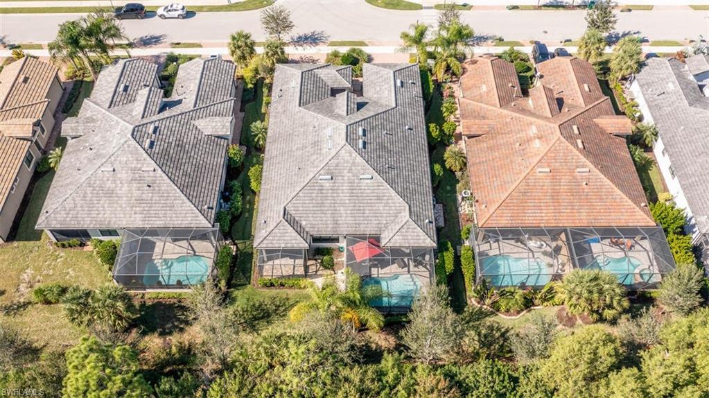 7682 Jacaranda Lane Naples, FL 34114 - Photo 36 of 44 an aerial view of multiple houses with outdoor space