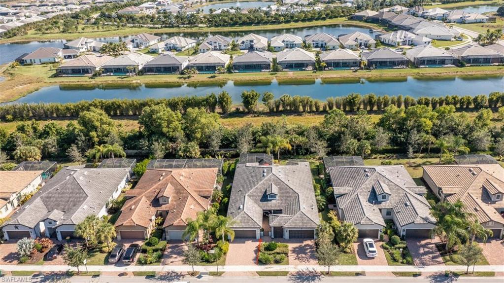 7682 Jacaranda Lane Naples, FL 34114 - Photo 37 of 44 an aerial view of a city with lake view