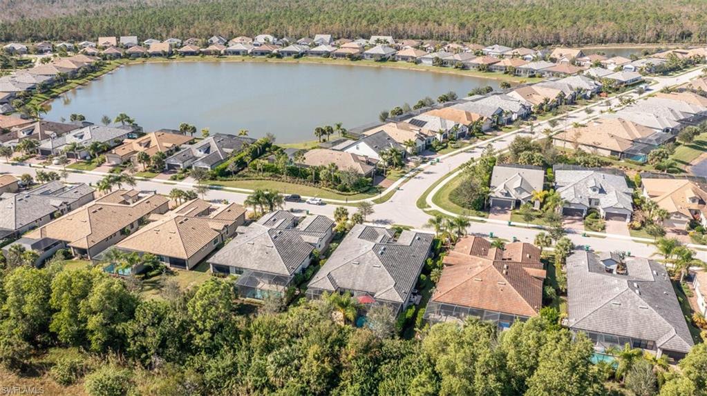 7682 Jacaranda Lane Naples, FL 34114 - Photo 38 of 44 an aerial view of house with yard and lake view