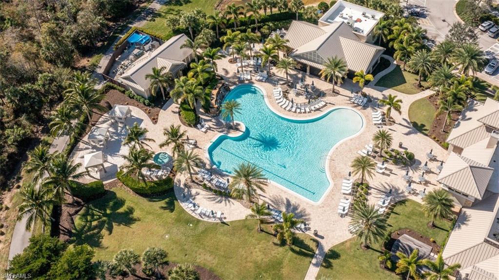 7682 Jacaranda Lane Naples, FL 34114 - Photo 40 of 44 an aerial view of a house with a yard and large trees