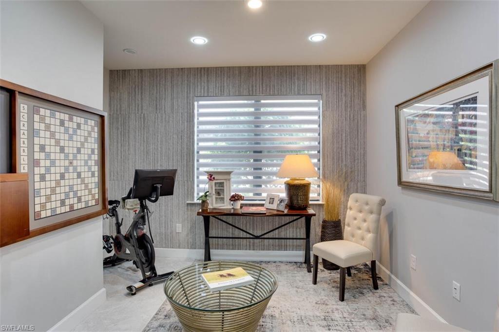 7682 Jacaranda Lane Naples, FL 34114 - Photo 4 of 44 a room with furniture and a window