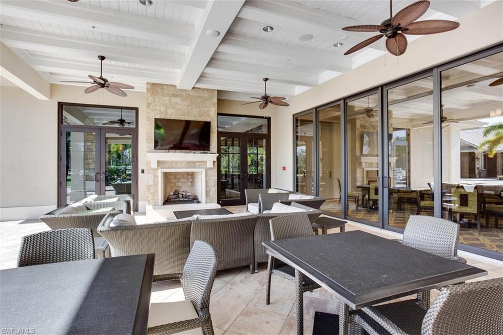 7682 Jacaranda Lane Naples, FL 34114 - Photo 41 of 44 a view of a dining room with furniture window and wooden floor
