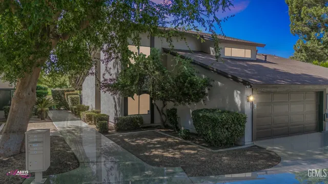 a view of a house with a tree