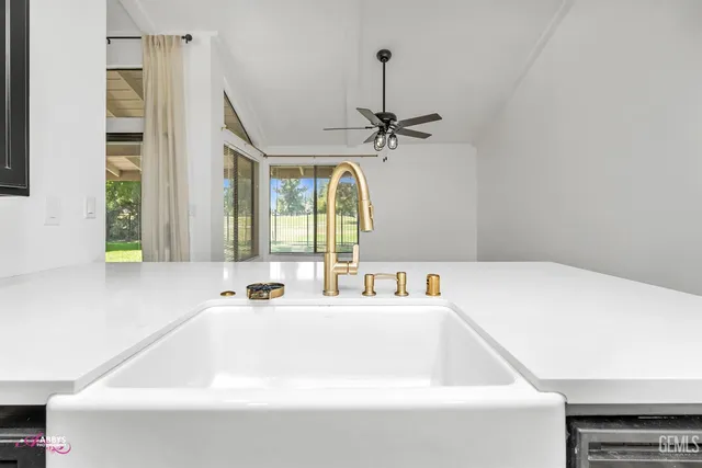 a bathroom with a tub sink and mirror