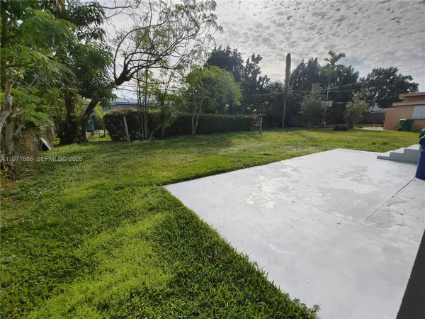 a backyard of a house with lots of green space