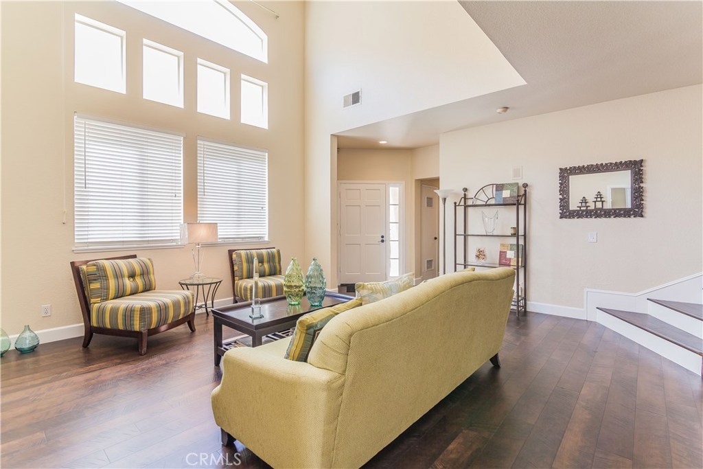 743 Orchard Loop Azusa, CA 91702 - Photo 11 of 39 a living room with furniture and a large window