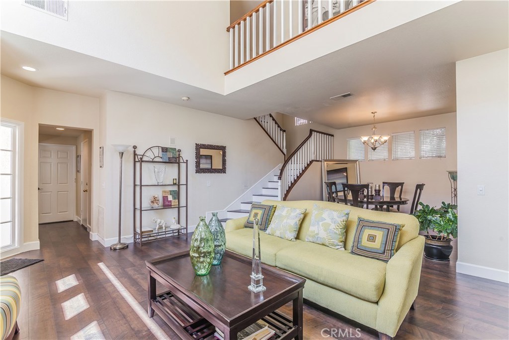 743 Orchard Loop Azusa, CA 91702 - Photo 12 of 39 a living room with furniture and wooden floor