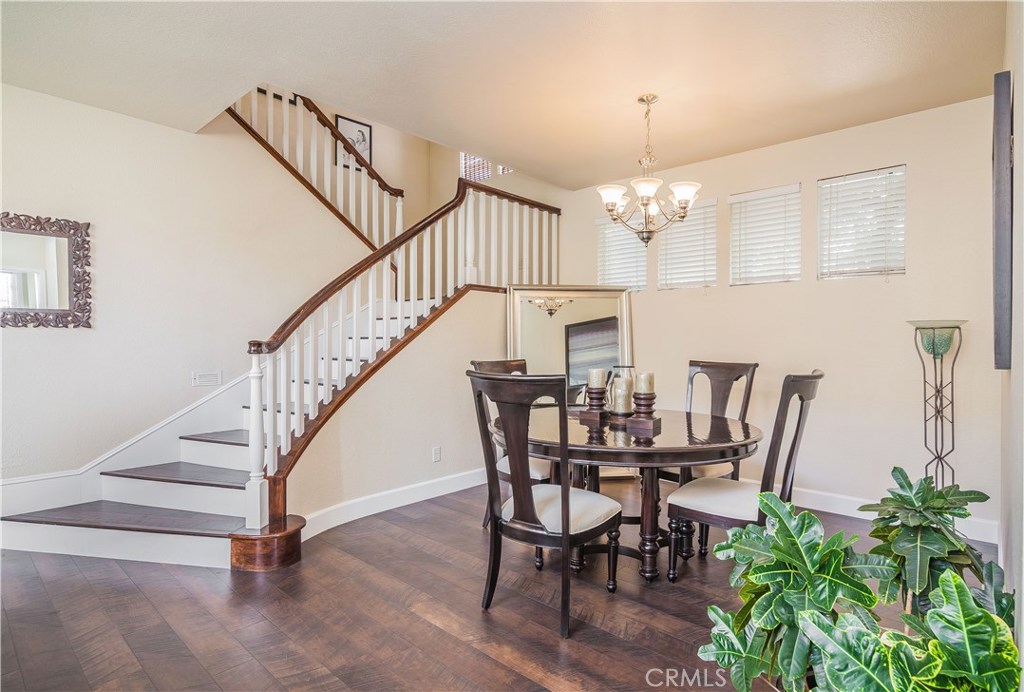 743 Orchard Loop Azusa, CA 91702 - Photo 13 of 39 a view of a dining room with furniture and wooden floor