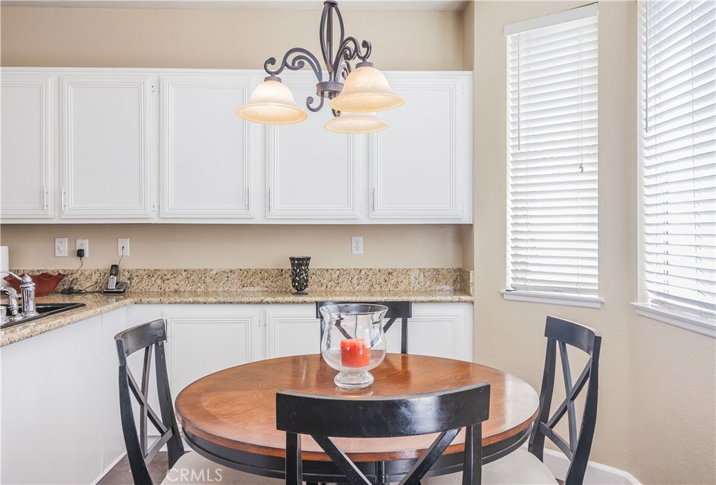 743 Orchard Loop Azusa, CA 91702 - Photo 16 of 39 a view of a dining room with furniture and window