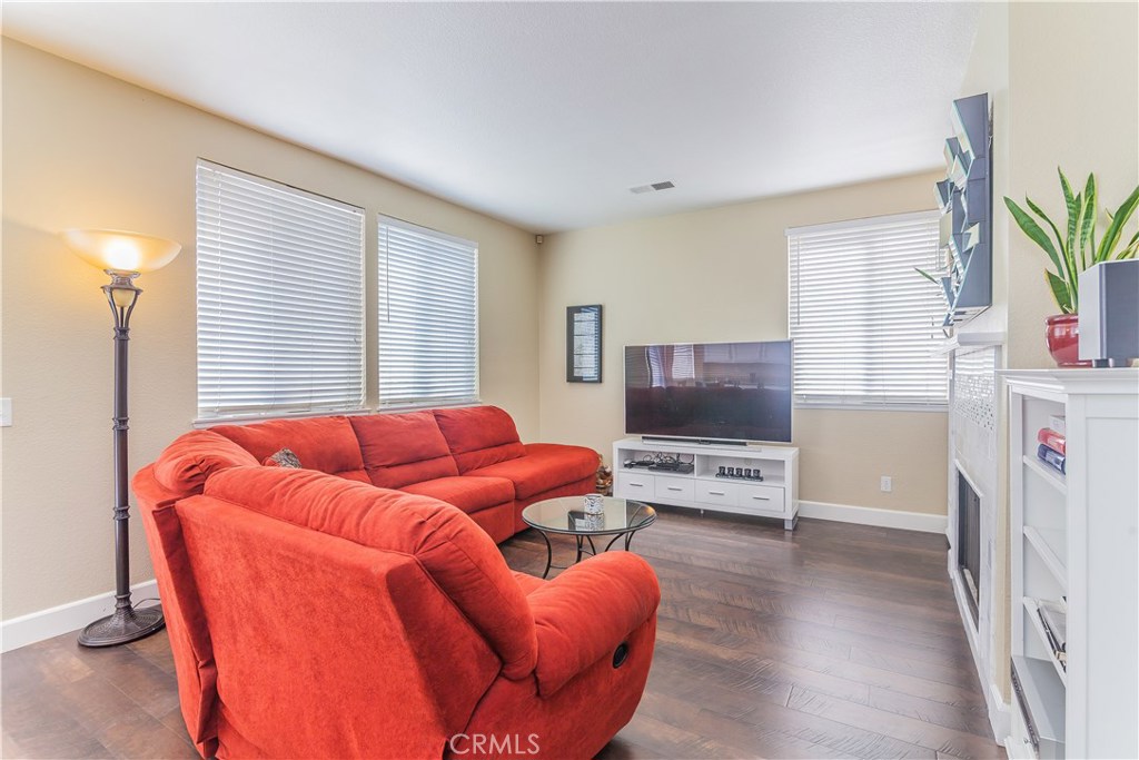 743 Orchard Loop Azusa, CA 91702 - Photo 19 of 39 a living room with furniture and a flat screen tv