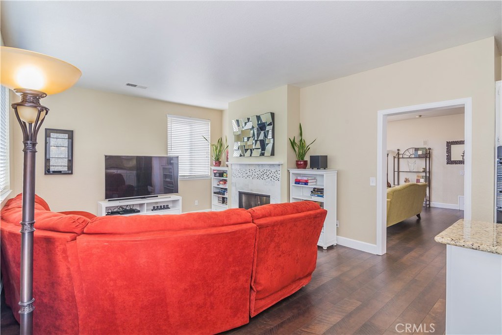 743 Orchard Loop Azusa, CA 91702 - Photo 20 of 39 a living room with furniture and a flat screen tv