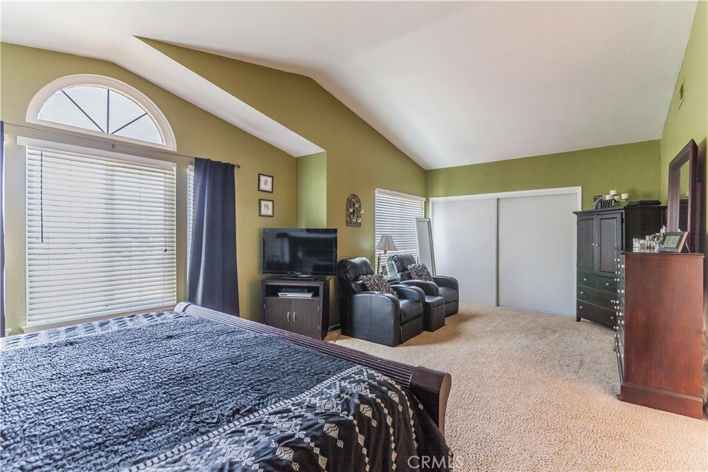743 Orchard Loop Azusa, CA 91702 - Photo 25 of 39 a bedroom with a bed and a television in it