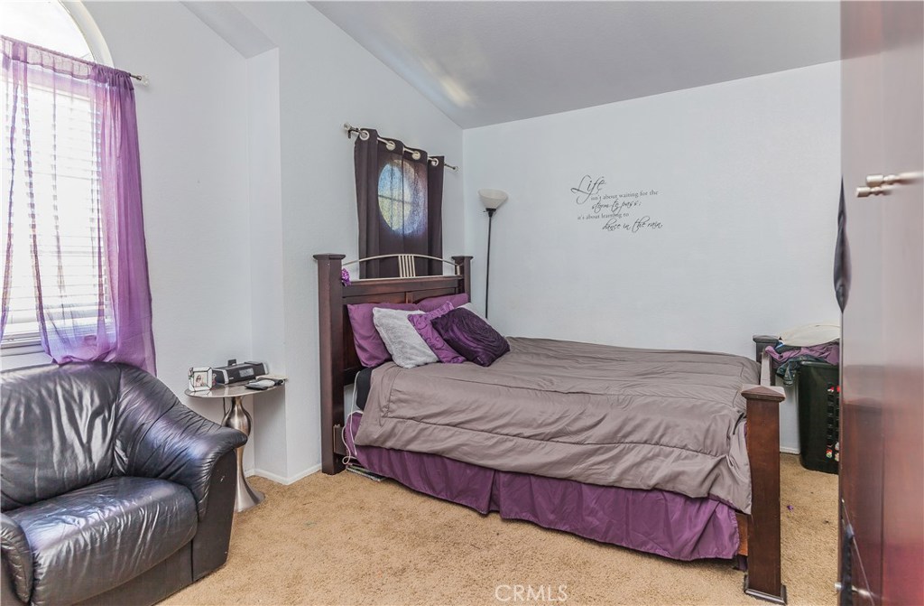 743 Orchard Loop Azusa, CA 91702 - Photo 28 of 39 a bedroom with a bed couch and window