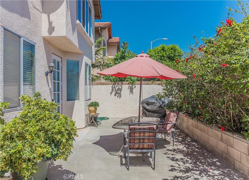 743 Orchard Loop Azusa, CA 91702 - Photo 36 of 39 a view of a patio with furniture and a garden