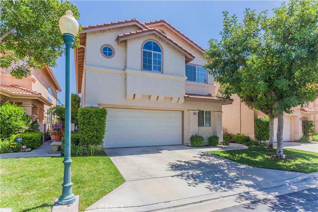 743 Orchard Loop Azusa, CA 91702 - Photo 5 of 39 a front view of a house with a yard