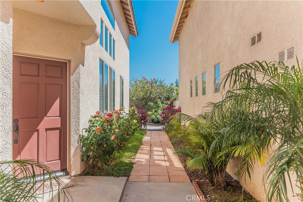 743 Orchard Loop Azusa, CA 91702 - Photo 7 of 39 a view of a pathway with house on both side