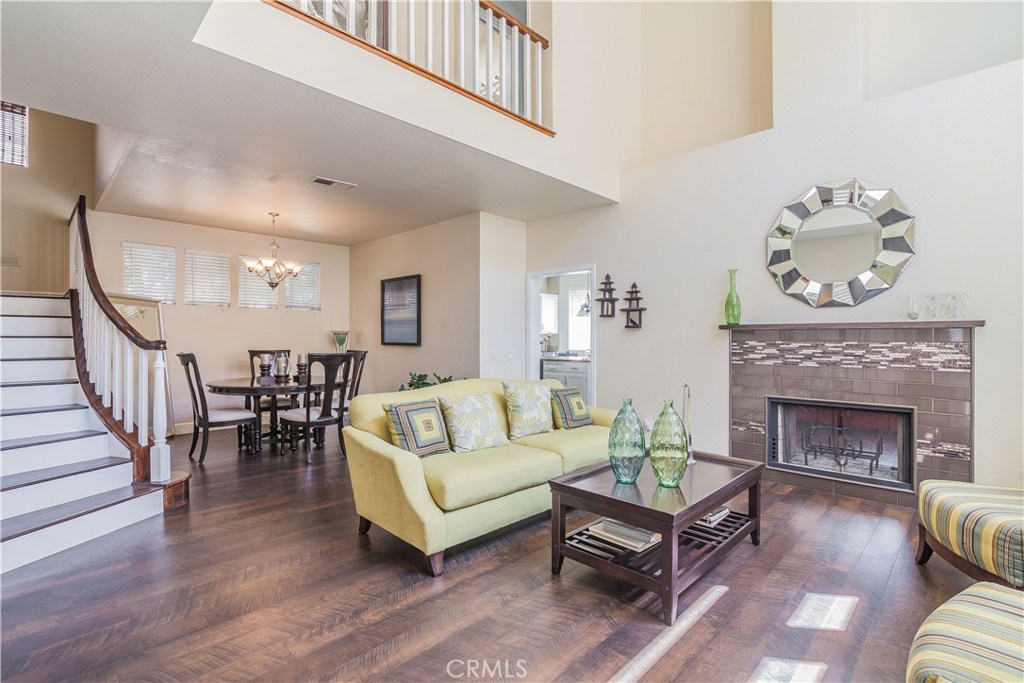 743 Orchard Loop Azusa, CA 91702 - Photo 8 of 39 a living room with furniture and a fireplace