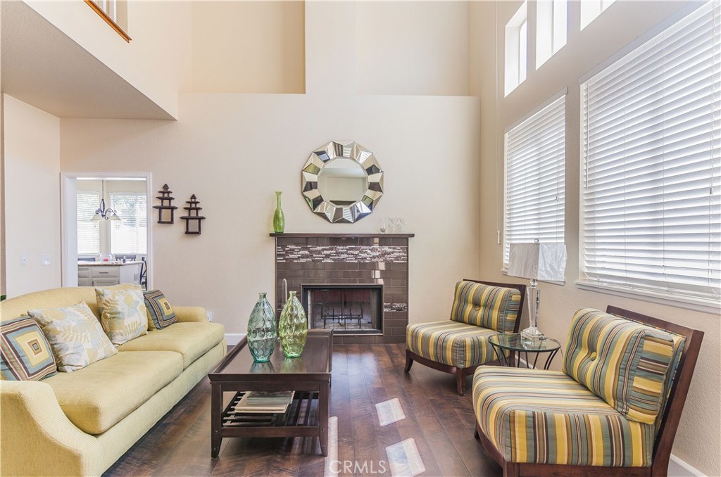 743 Orchard Loop Azusa, CA 91702 - Photo 10 of 39 a living room with furniture and a fireplace