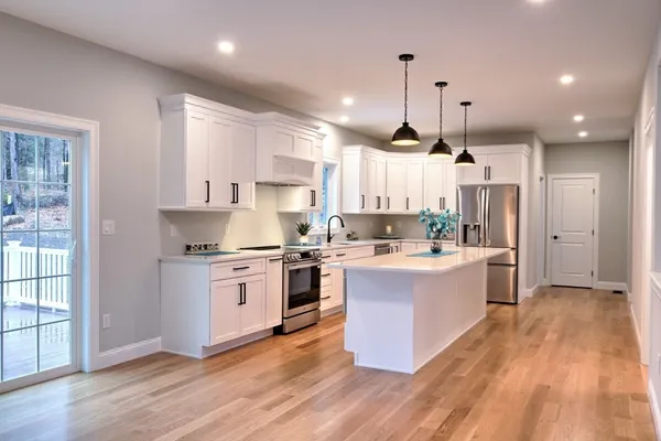 a bathroom with a sink toilet and window