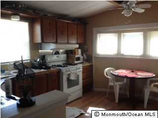 1 Grace Lane Howell, NJ 07731 - Photo 2 of 3 a kitchen with a stove and a refrigerator