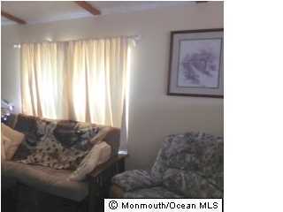 1 Grace Lane Howell, NJ 07731 - Photo 3 of 3 a living room with furniture and a window