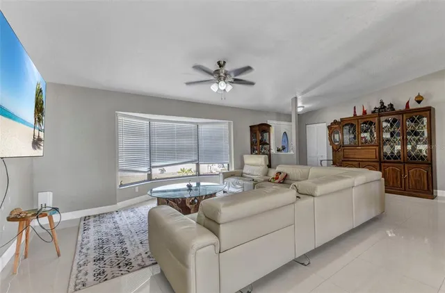 a living room with fireplace furniture and a flat screen tv