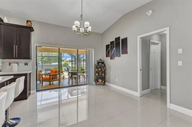 a kitchen with stainless steel appliances kitchen island granite countertop a sink and cabinets