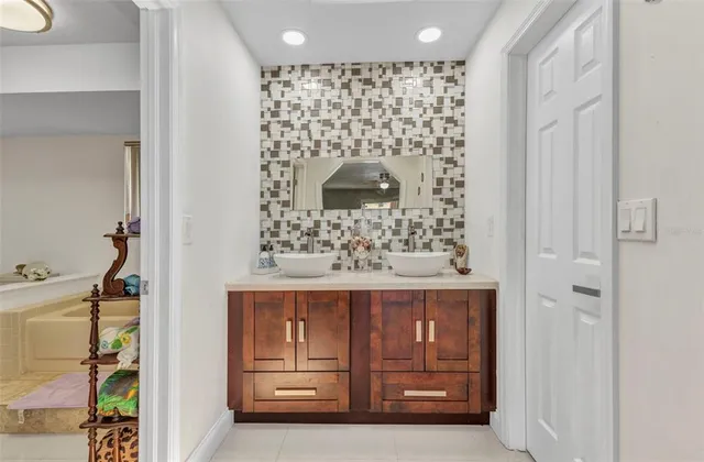 a bathroom with a bathtub and shower
