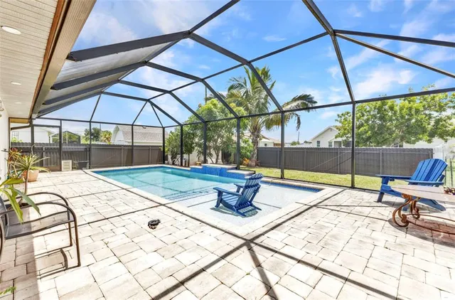 a view of a balcony with chairs and a table