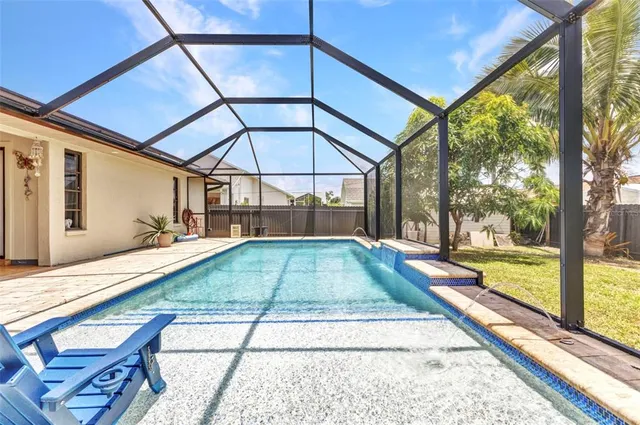 a view of swimming pool with a yard
