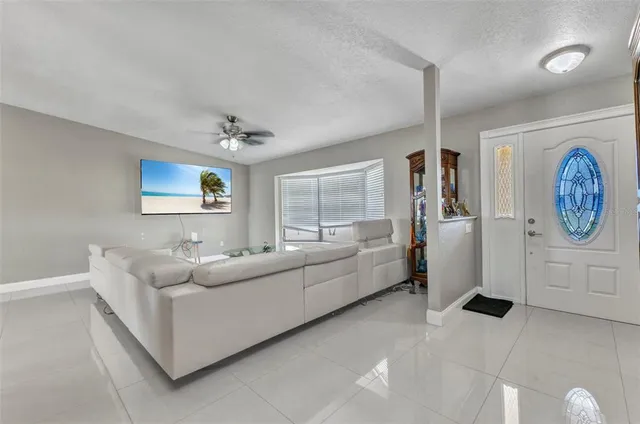 a view of living room with furniture and window