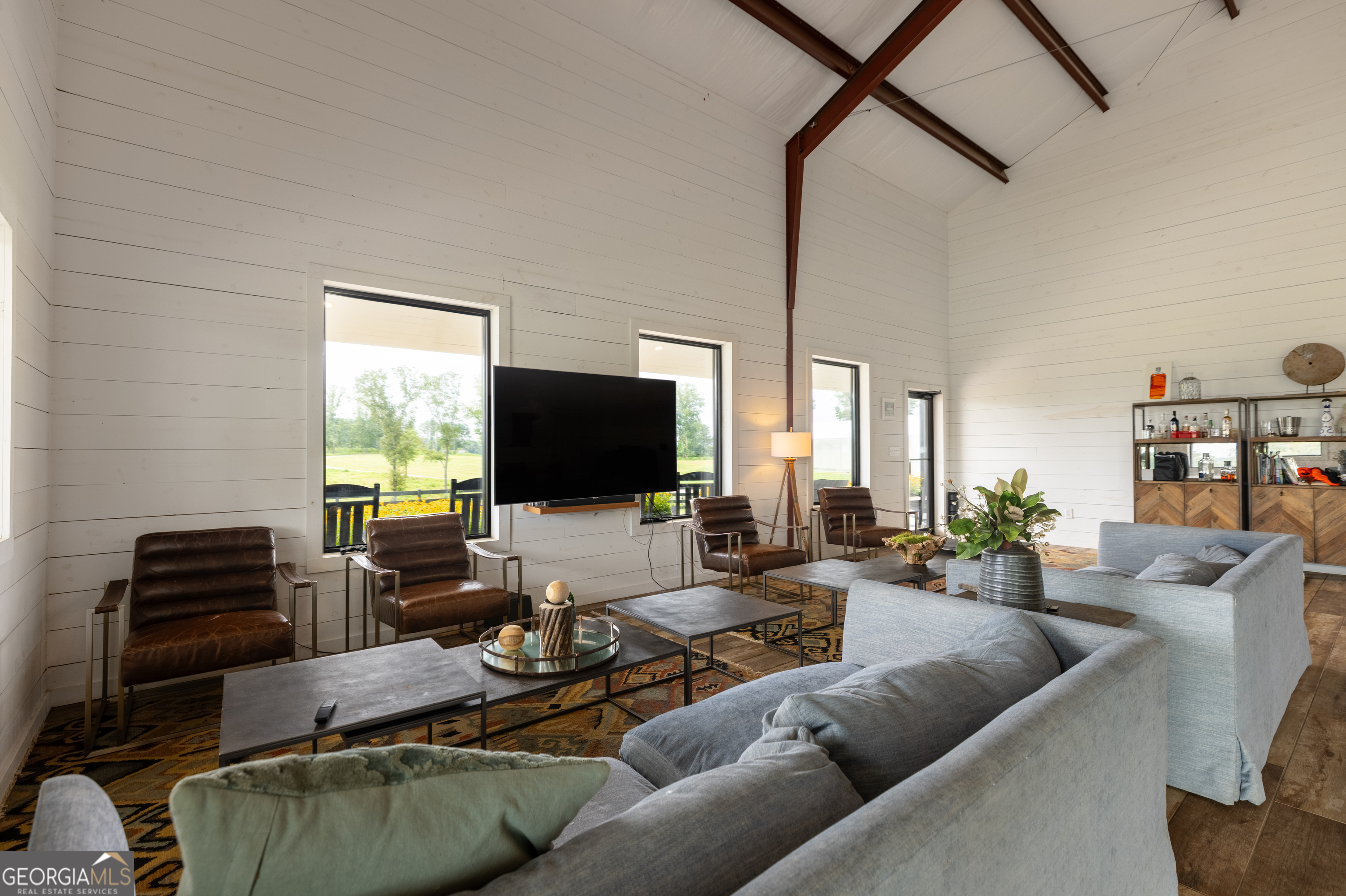 2199 Roosterville Road Roopville, GA 30170 - Photo 16 of 129 a living room with furniture and a flat screen tv