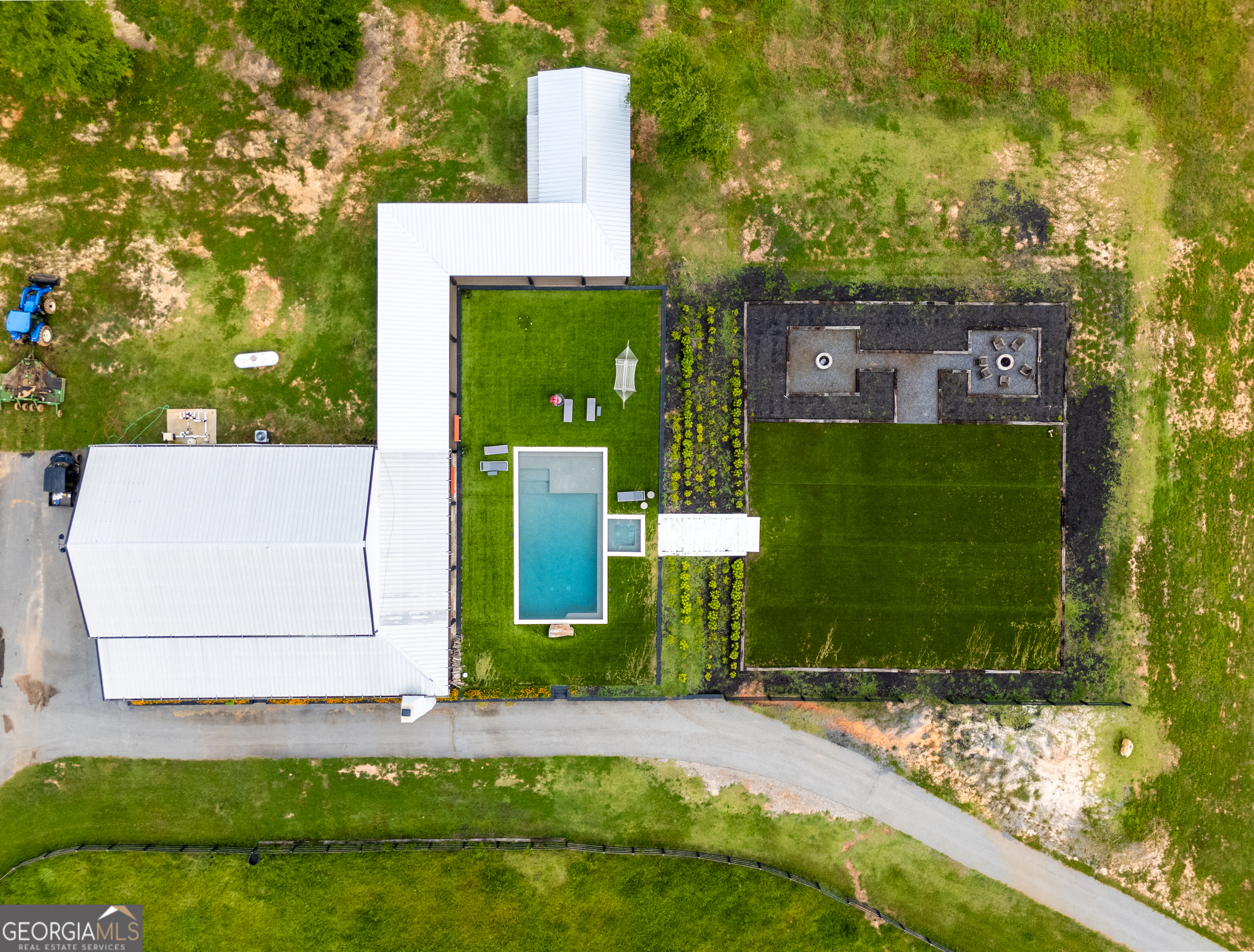 2199 Roosterville Road Roopville, GA 30170 - Photo 26 of 129 a front view of a house with a yard and garage