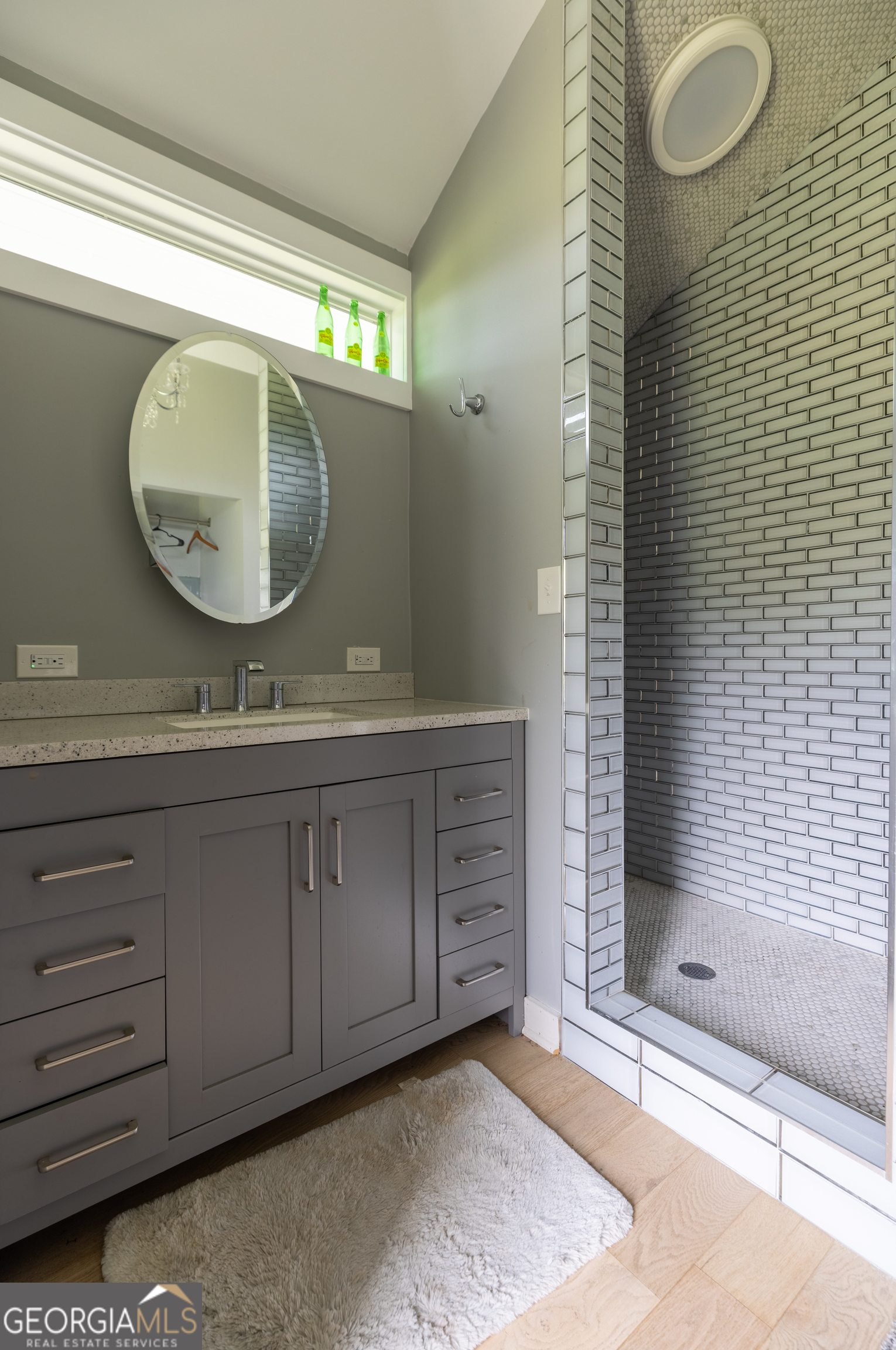 2199 Roosterville Road Roopville, GA 30170 - Photo 42 of 129 a bathroom with a double vanity sink mirror and shower